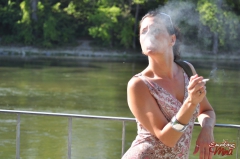 Brunette babe smoking at the riverside - N