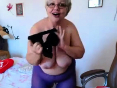 Granny playing with big boobs on webcam! Amateur!